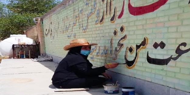 معلمی که در رودان جهاد مشق می کند+عکس